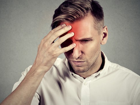 a red area on a man's forehead depicts the location of pain