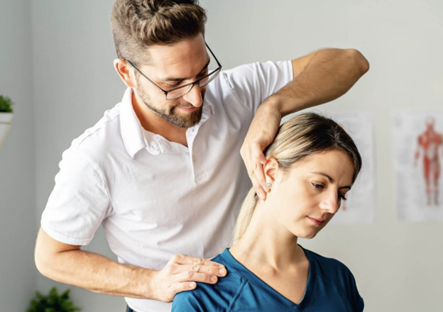 Pain after an accident - Bodywork therapist providing manual neck therapy to relieve woman’s pain and tension